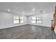 Bright living room with wood floors, recessed lighting, and large windows offering plenty of natural light at 1016 Mandalay Dr, Brandon, FL 33511