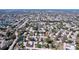 A picturesque aerial view of a quiet residential neighborhood with mature trees and manicured lawns at 10525 Mira Vista Dr, Port Richey, FL 34668