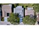 A bird's-eye view showcasing the home's roof and surrounding mature trees at 10525 Mira Vista Dr, Port Richey, FL 34668