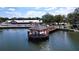 Community aerial view featuring a serene lake, a gazebo, and an American flag at 10525 Mira Vista Dr, Port Richey, FL 34668