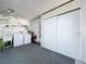 Functional laundry room with washer, dryer, utility sink, and storage space at 10525 Mira Vista Dr, Port Richey, FL 34668