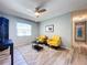 The well-lit living room offers new flooring, ample space, and a welcoming atmosphere for gatherings at 10525 Mira Vista Dr, Port Richey, FL 34668