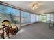 Bright and airy sunroom with plenty of natural light and comfortable seating at 10525 Mira Vista Dr, Port Richey, FL 34668
