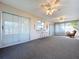 Spacious sunroom with access to the outdoors through large sliding glass doors at 10525 Mira Vista Dr, Port Richey, FL 34668