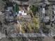 Aerial view of home showcasing the backyard with a patio, lush greenery, and surrounding neighborhood at 1213 60Th S St, Gulfport, FL 33707