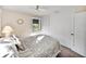 Cozy bedroom featuring carpet, closet, ceiling fan, and natural light at 1213 60Th S St, Gulfport, FL 33707