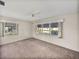 Bright bedroom with neutral carpet and multiple windows offering natural light at 1213 60Th S St, Gulfport, FL 33707