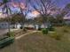 Inviting single Gathering home with mature trees, well-maintained lawn, and charming blue facade at 1213 60Th S St, Gulfport, FL 33707