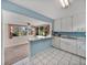 Open kitchen with breakfast bar looking into a sunroom at 1213 60Th S St, Gulfport, FL 33707