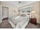 Comfortable main bedroom with natural light, ceiling fan, and access to an additional room at 1213 60Th S St, Gulfport, FL 33707