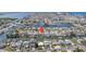 Wide aerial shot of waterfront homes, featuring a canal-front property with boat dock and beautiful water views at 13614 Evelane Dr, Hudson, FL 34667