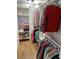 Walk-in closet with built-in shelving and hanging racks for optimal organization at 13614 Evelane Dr, Hudson, FL 34667
