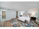 Bright main bedroom features a ceiling fan, ensuite bath and two large nightstands at 13614 Evelane Dr, Hudson, FL 34667