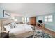 Spacious main bedroom with a sitting area, ceiling fan, and ample natural light at 13614 Evelane Dr, Hudson, FL 34667