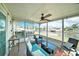 Enclosed patio with comfortable seating and views of the canal at 13614 Evelane Dr, Hudson, FL 34667