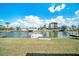 Beautiful waterfront view showcasing the property's canal access, lush landscaping, and serene surroundings at 13614 Evelane Dr, Hudson, FL 34667
