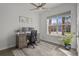 Office space filled with natural light, a modern ceiling fan and a view of tropical foliage at 14477 Trails Edge Blvd, Odessa, FL 33556