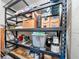 Organized storage shelving with boxes and bins for streamlined storage solutions in the home at 2085 Hunters Glen Dr # 228, Dunedin, FL 34698