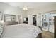 Bedroom with a large bed and ensuite access, as well as sliding glass doors to a lanai at 2509 Estancia Blvd, Clearwater, FL 33761
