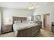 Bedroom showcasing a large bed, neutral color scheme, tile floors, and vaulted ceiling at 2509 Estancia Blvd, Clearwater, FL 33761