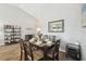 Dining room featuring a dark wood table set for six, with views into the foyer at 2509 Estancia Blvd, Clearwater, FL 33761
