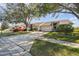 Well-maintained home featuring a two-car garage and a meticulously landscaped front yard at 2509 Estancia Blvd, Clearwater, FL 33761