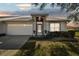 Charming single-story home with a well-maintained front yard and attached two-car garage at 2509 Estancia Blvd, Clearwater, FL 33761