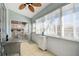 Covered lanai with tile flooring and wicker furniture, offering a view to the outside at 2509 Estancia Blvd, Clearwater, FL 33761
