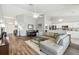 Spacious living room showing dining room and open access to kitchen, with vaulted ceilings at 2509 Estancia Blvd, Clearwater, FL 33761
