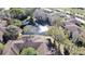 Scenic aerial view of the community showcasing lush landscaping, mature trees, and a serene pond at 2689 Sabal Springs Cir # 103, Clearwater, FL 33761