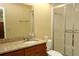 Bathroom with granite countertop, sink, mirror, toilet, and shower at 2689 Sabal Springs Cir # 103, Clearwater, FL 33761