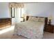 Comfortable bedroom features carpet, large window, and furnishings at 2689 Sabal Springs Cir # 103, Clearwater, FL 33761