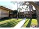 Two-story condo community showcasing lush landscaping, mature trees, and inviting walkways at 2689 Sabal Springs Cir # 103, Clearwater, FL 33761