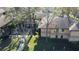 Community exterior featuring well maintained grounds, mature trees, and two-story buildings at 2689 Sabal Springs Cir # 103, Clearwater, FL 33761