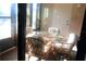 Enclosed lanai offers comfortable seating around a glass top table at 2689 Sabal Springs Cir # 103, Clearwater, FL 33761