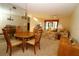 Inviting dining and living space with comfortable seating, natural light, and a large decorative mirror at 2689 Sabal Springs Cir # 103, Clearwater, FL 33761