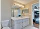 Bathroom boasts a large vanity mirror and white cabinets at 2723 W Arch St, Tampa, FL 33607