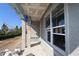 Home under construction with visible framing and wrapped beams near the patio area at 28784 Rambutan Dr, Wesley Chapel, FL 33543