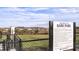Community dog park with fences, landscaping, and posted park rules at 29924 Rusco Ct, Wesley Chapel, FL 33545