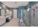 Modern bathroom with double vanities, a large glass shower with rainfall shower head, and marble floors at 29924 Rusco Ct, Wesley Chapel, FL 33545