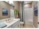 Bathroom featuring tub and shower, vanity, blue accent wall, and tile floor at 29924 Rusco Ct, Wesley Chapel, FL 33545