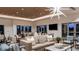 Spacious clubhouse with a lounge area, dining tables, and large windows showcasing the community at 29924 Rusco Ct, Wesley Chapel, FL 33545