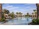 Resort-style pool area with lounge chairs, palm trees, and cabanas, creating a luxurious outdoor experience at 29924 Rusco Ct, Wesley Chapel, FL 33545