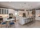 Bright, open kitchen featuring a central island with seating and stainless steel appliances at 29924 Rusco Ct, Wesley Chapel, FL 33545