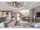 Spacious living room and dining room design featuring contemporary decor and lots of natural light at 29924 Rusco Ct, Wesley Chapel, FL 33545