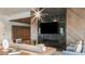 Inviting lounge area with fireplace, comfortable seating, and stylish decor for relaxing and socializing at 29924 Rusco Ct, Wesley Chapel, FL 33545