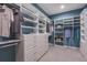 Organized walk-in closet with custom shelves and drawers for ample storage at 29924 Rusco Ct, Wesley Chapel, FL 33545