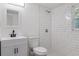 Bathroom featuring white subway tile shower and modern vanity at 306 Midwood Dr, Plant City, FL 33566