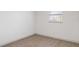 White bedroom with two windows and luxury vinyl plank flooring at 306 Midwood Dr, Plant City, FL 33566
