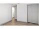 Bedroom featuring a closet and luxury vinyl plank flooring at 306 Midwood Dr, Plant City, FL 33566